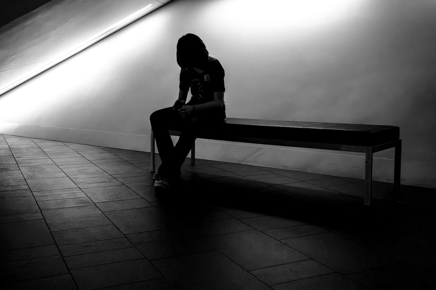 A Tribe member photograph — a solitary figure in shadow